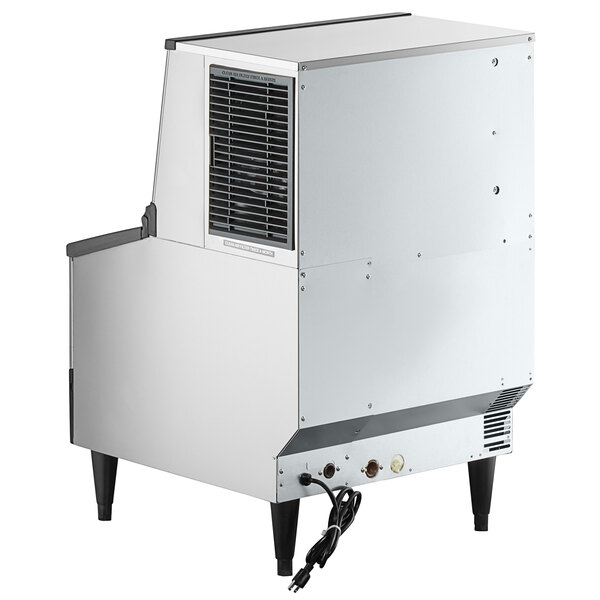 A stainless steel undercounter ice machine with built-in storage bin and air-cooled vent.