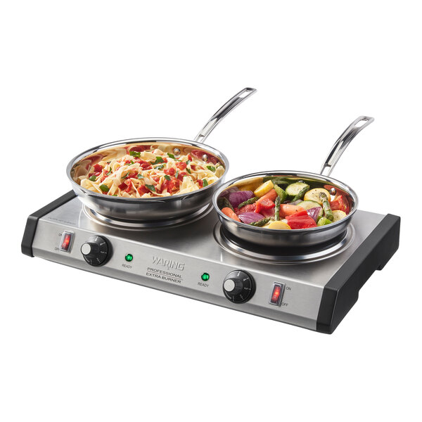 A double burner electric countertop range with two pans of food on top.