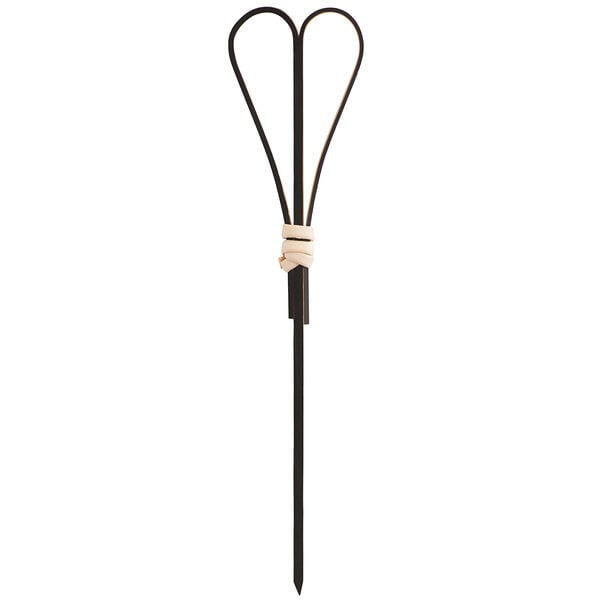 A black bamboo heart-shaped food pick or skewer with a decorative knot near the top.