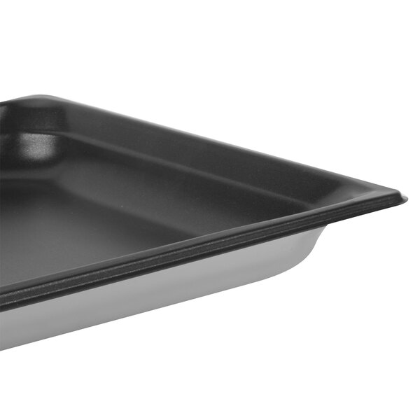 A Vollrath stainless steel steam table pan on a counter.