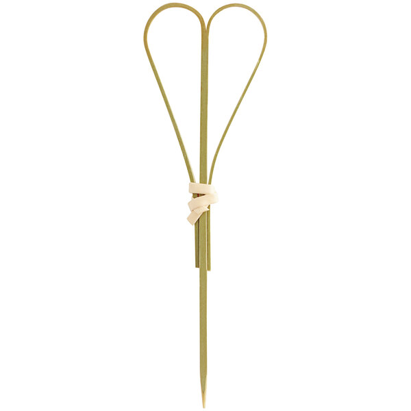 A natural bamboo food pick shaped like a heart, commonly used for serving appetizers or garnishes.