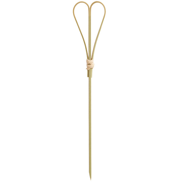 A natural bamboo food pick with a heart-shaped loop at the top.