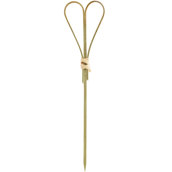 A natural bamboo food pick with a heart-shaped loop at the top.