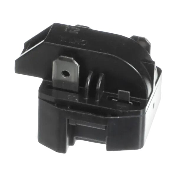 A black compressor relay component for Delfield refrigeration units.