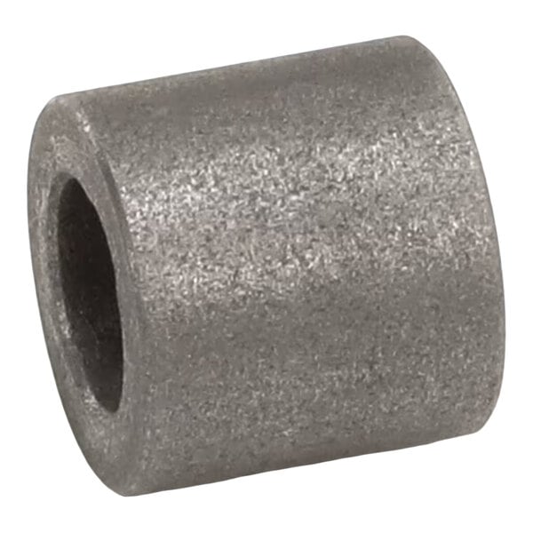 A cylindrical metal bearing with a hollow center.