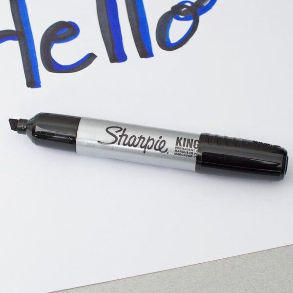A Sharpie King Size black chisel tip permanent marker with a silver and black body.