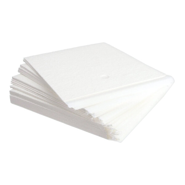 A stack of white rectangular fryer filters with a small hole in the center, measuring 17.5 by 19.5 inches.