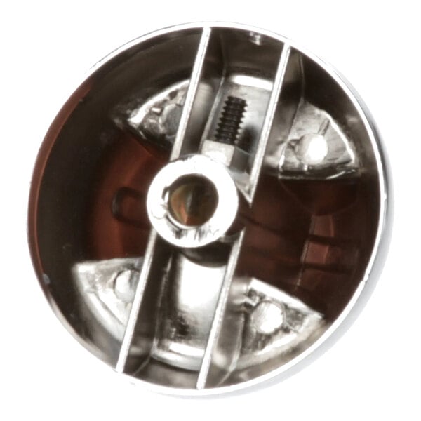 A round metal control knob for a Jade Range appliance.