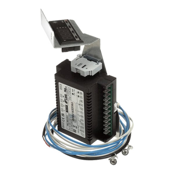 An electronic defrost control module with wiring and mounting hardware for a Traulsen refrigeration unit.