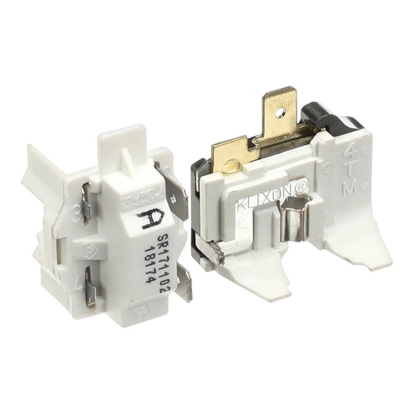 A pair of white electrical components for a Silver King 10344-98 Kit Electricals 115V Ta1340Y-D.