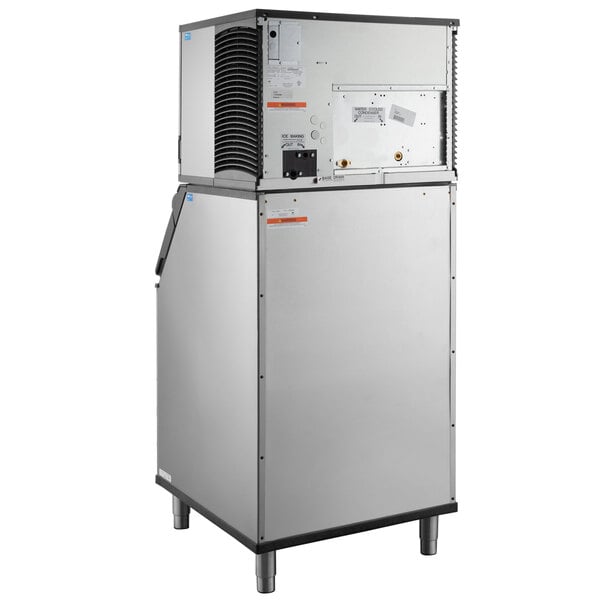 A commercial water-cooled ice machine with a large storage bin.