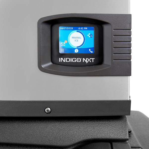 An Indigo NXT air-cooled half dice cube ice machine with a digital display and storage bin.