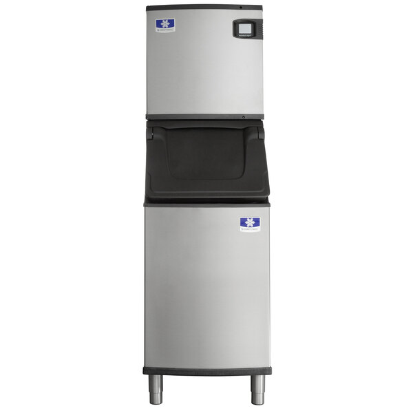 A commercial stainless steel ice machine with a storage bin.