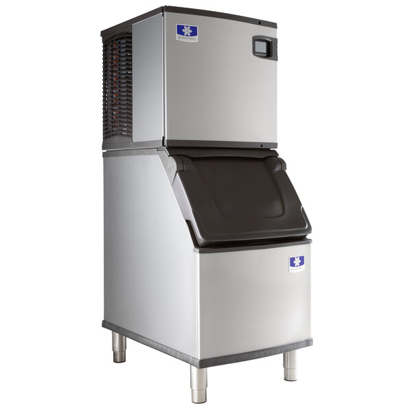 A commercial Manitowoc air-cooled ice machine with a storage bin.