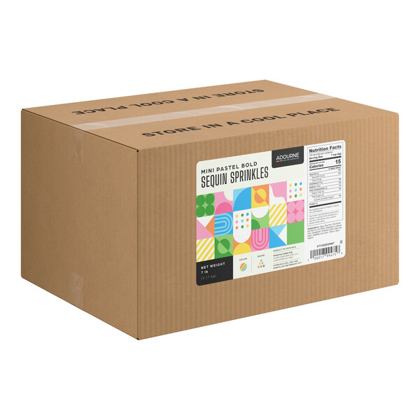 A large brown cardboard box with a colorful label indicating it contains mini pastel bold sequin sprinkles, weighing 7 pounds.