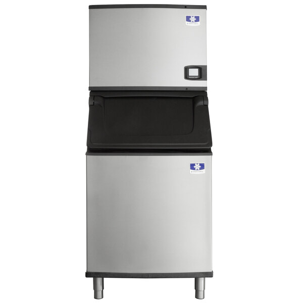 A commercial stainless steel ice machine with a large storage bin.