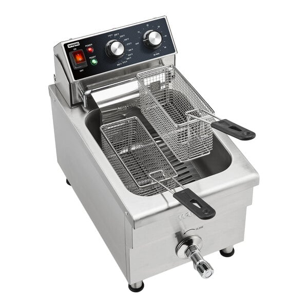 A stainless steel commercial countertop deep fryer with two fryer baskets and control knobs on the front panel.