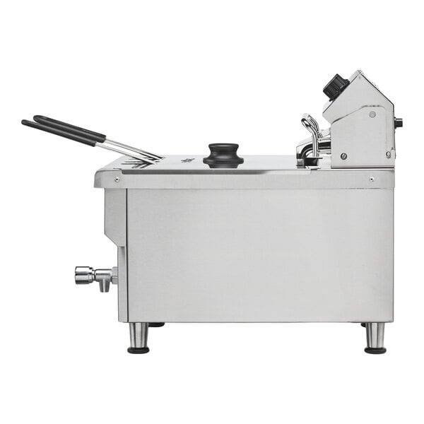 A stainless steel heavy-duty commercial countertop deep fryer with a lid and basket.