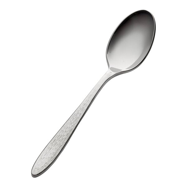 A stainless steel extra heavy weight teaspoon with a textured handle.