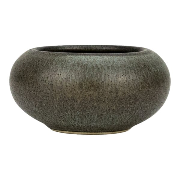A round, green and brown stoneware ramekin with a wide, low profile.