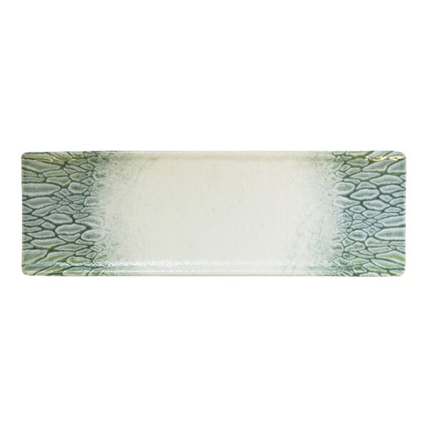 A rectangular green and white china tray with a textured pattern on the ends.