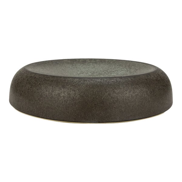 A round, green and brown stoneware elevated plate with a wide rim.