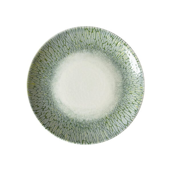 A round green and white china coupe plate with a textured pattern around the rim.