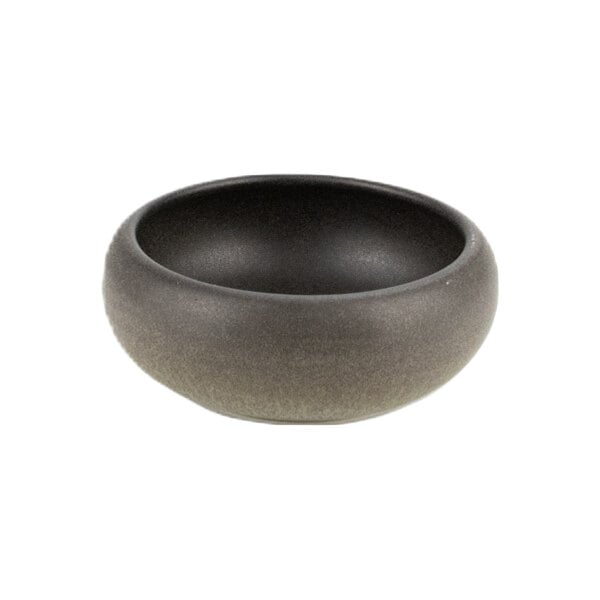 A small round green and brown stoneware bowl with a smooth matte finish.