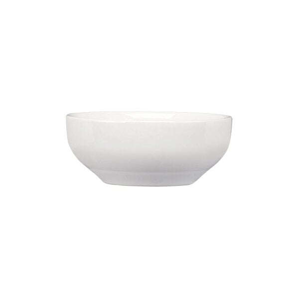 A plain white round stoneware bowl with a smooth finish.