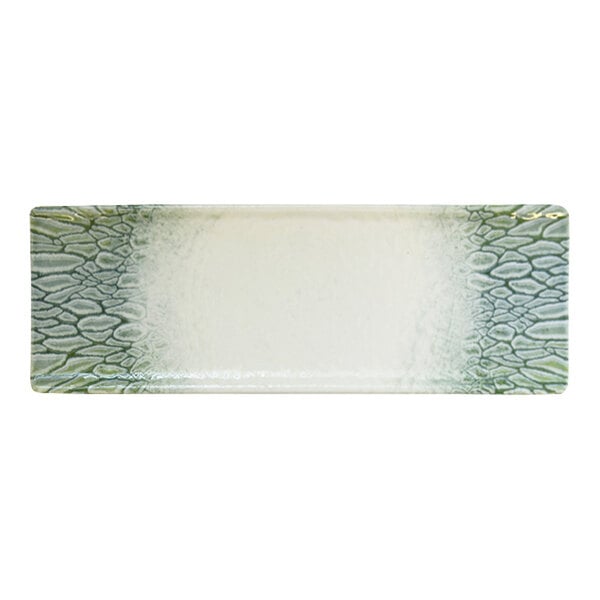 A rectangular green and white china tray with a textured pattern along the edges.