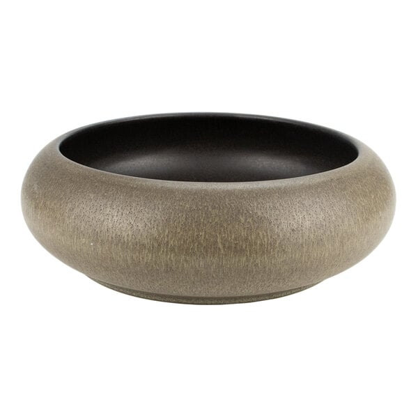 A round, green and brown stoneware bowl with a wide, shallow design.