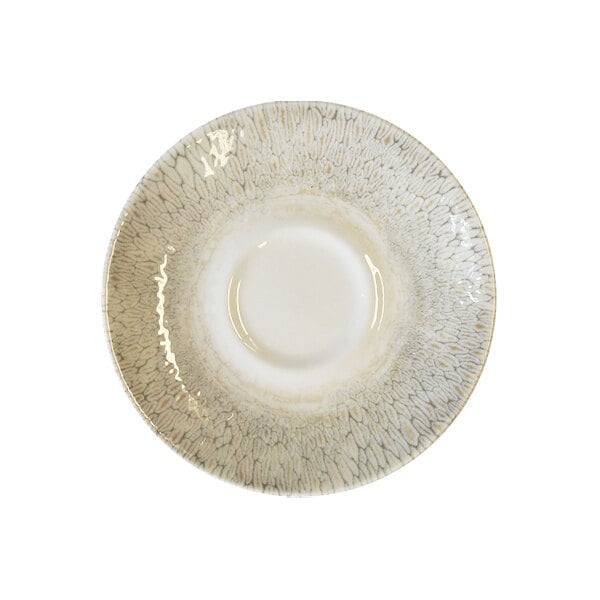 A beige china saucer with a textured pattern around the rim.