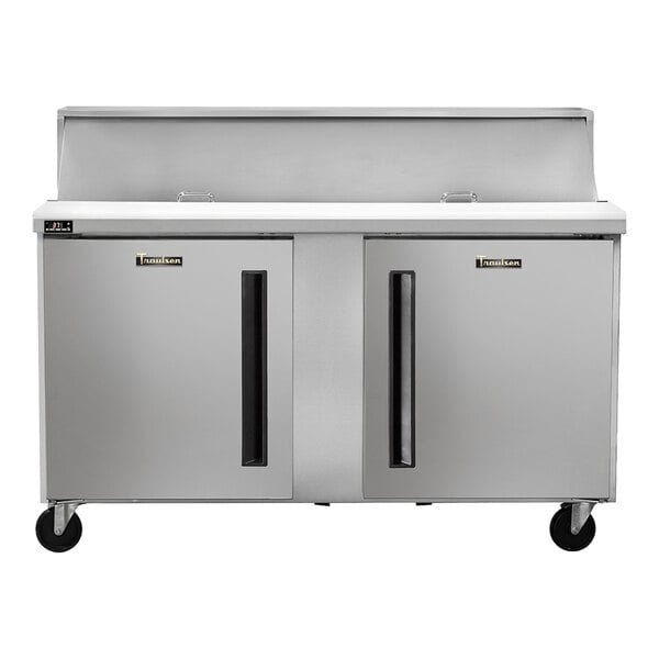 A stainless steel two-door refrigerated sandwich prep table on wheels.