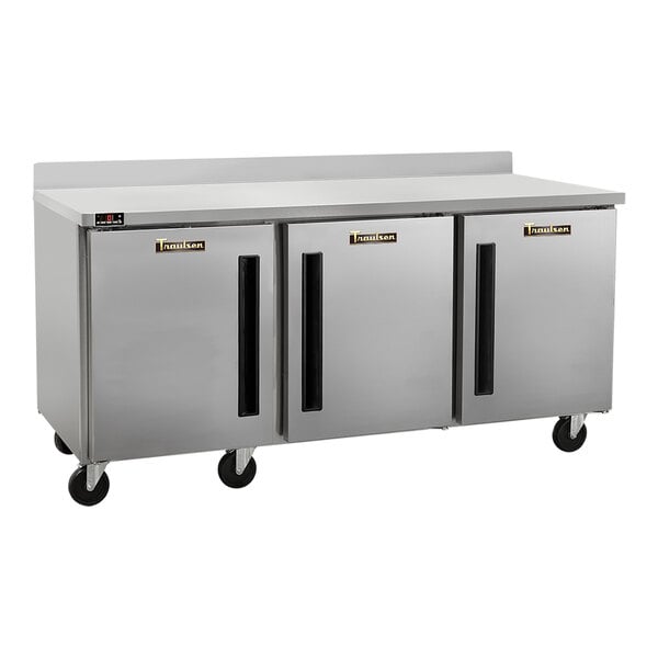 A stainless steel three-door worktop refrigerator with a 4-inch backsplash and casters.