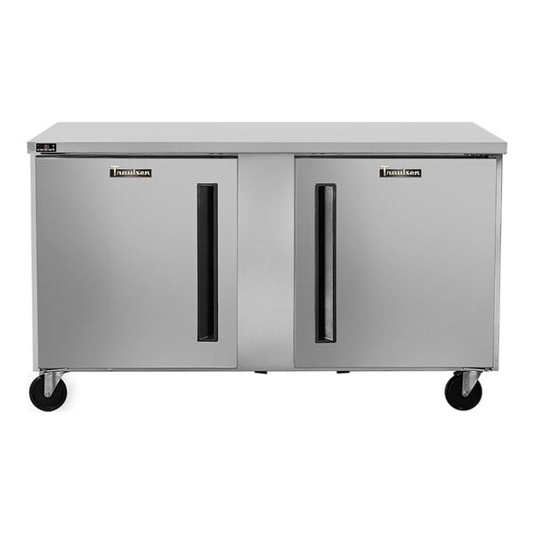 A stainless steel undercounter freezer with two doors and caster wheels.