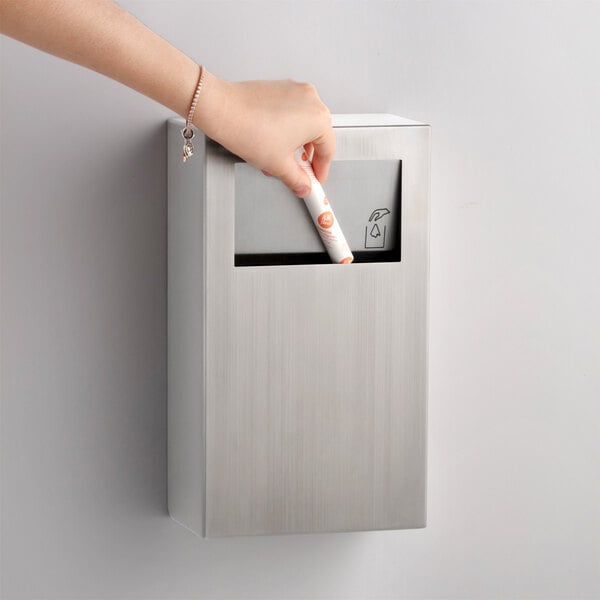 A stainless steel surface-mounted sanitary napkin disposal unit with a satin finish.