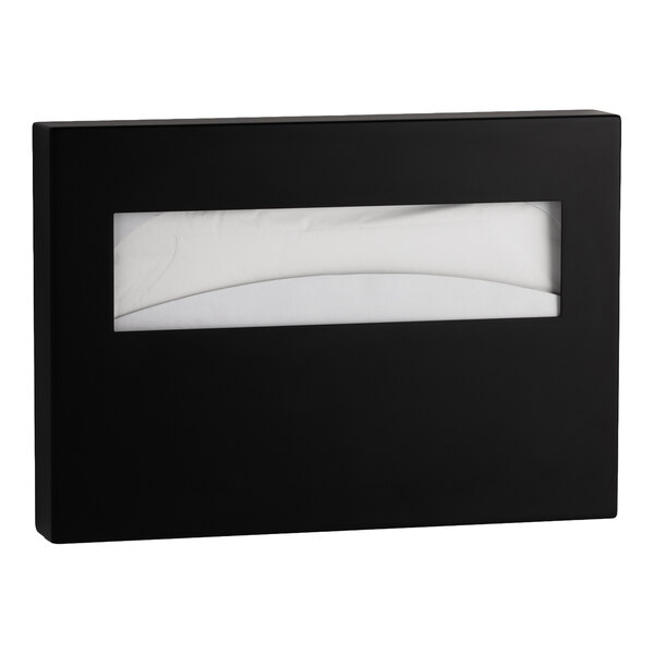 A rectangular, matte black surface-mounted seat cover dispenser with a horizontal window showing white seat covers inside.