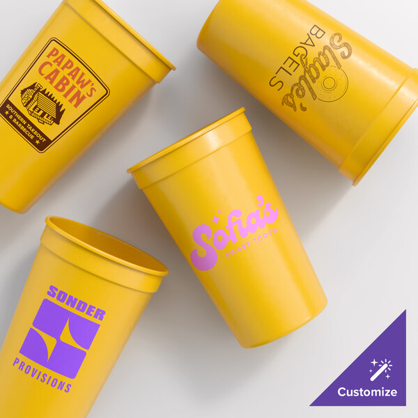 Novolex Memorables 22 oz. Customizable Yellow Tall Plastic Souvenir Cup - 500/Case