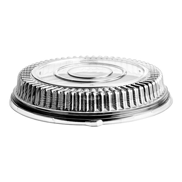 A clear, round, ribbed plastic dome lid attached to a black circular tray, viewed from the side.