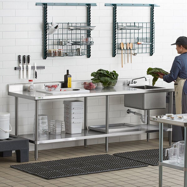 A stainless steel work table with an integrated right-side sink and an undershelf, designed for commercial kitchen use.