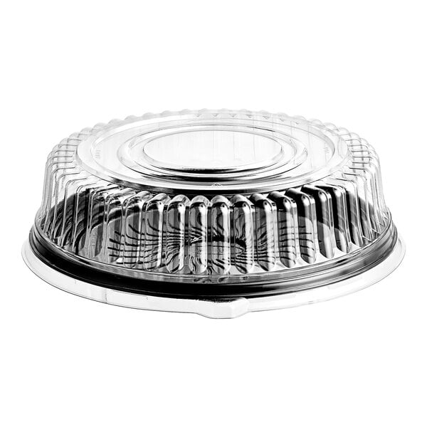 A clear, round, ribbed plastic dome lid attached to a black circular tray, commonly used for catering or food storage.