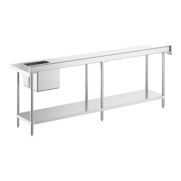 A long stainless steel work table with an integrated sink on the right side and an undershelf.