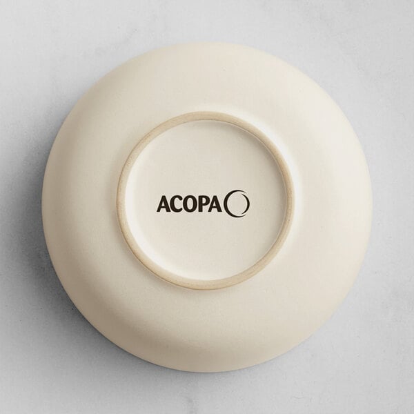The image shows the underside of a round, off-white bowl with the brand name 'ACOPA' printed in black on the base.