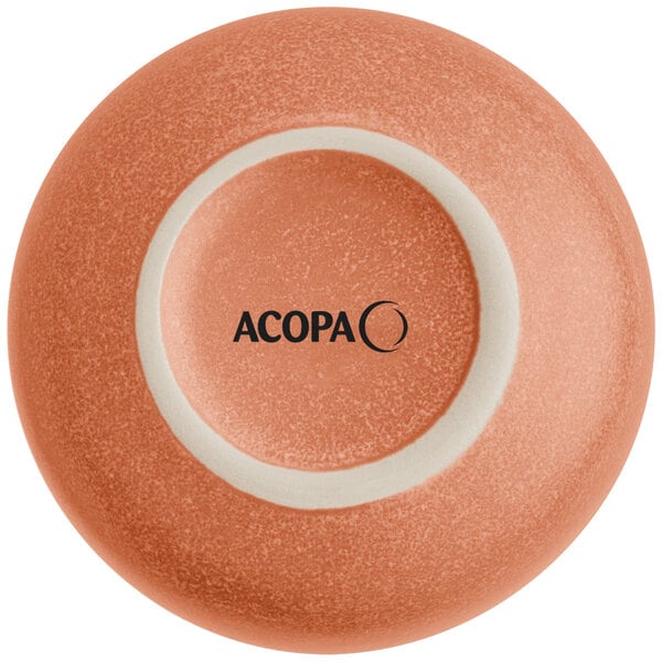 The image shows the bottom view of a round, terra cotta-colored dish with a matte finish and the brand name 'ACOPA' printed on the base.