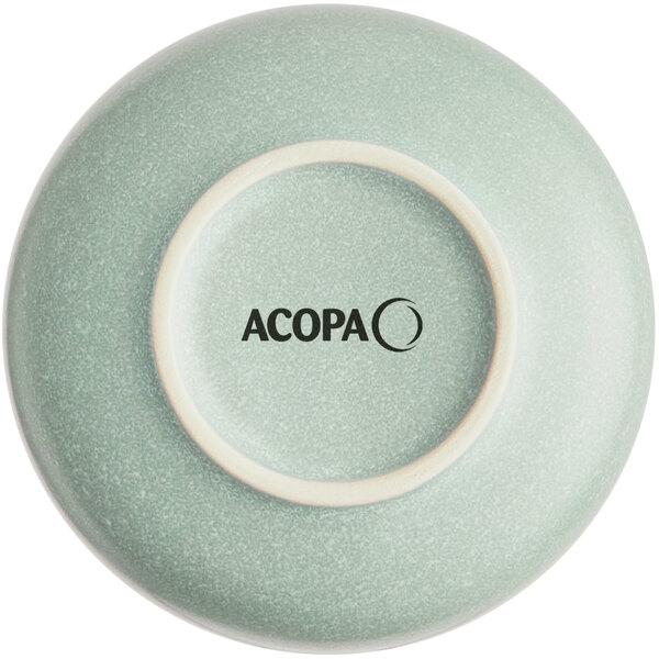 The image shows the underside of a light blue-green bowl with a matte finish and the word 'ACOPA' printed in black on the base.