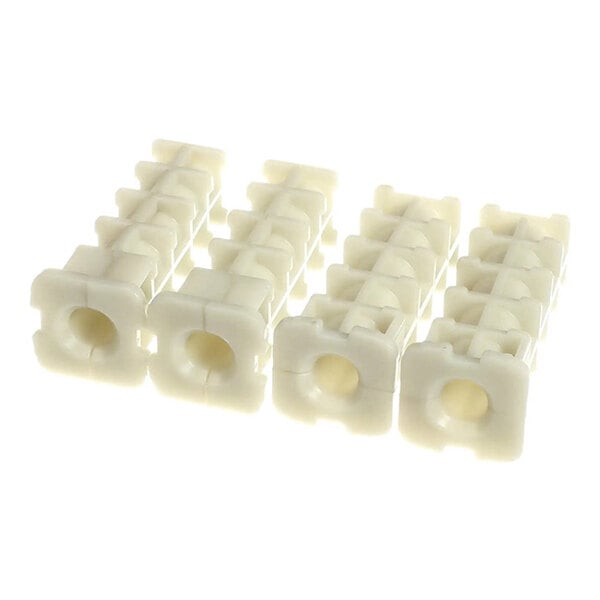 A set of four white Cambro upright post inserts for shelving units.