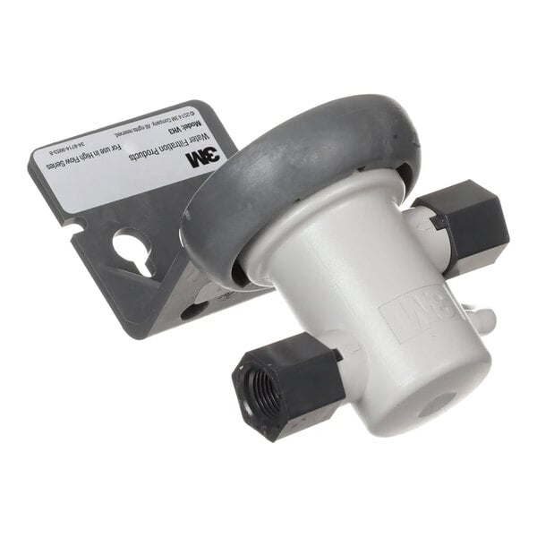 A 3M 6213033 head assembly for water filtration systems with NPT connections.