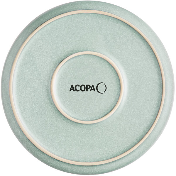 A round, matte blue plate with a subtle speckled texture and the word 'ACOPA' printed in the center.