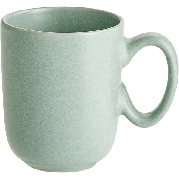 A light blue matte-finish cup with a rounded body and a large handle.
