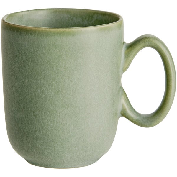 A sage green matte finish cup with a rounded handle.